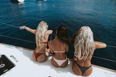 Women relaxing together on a yacht in a lifestyle photo